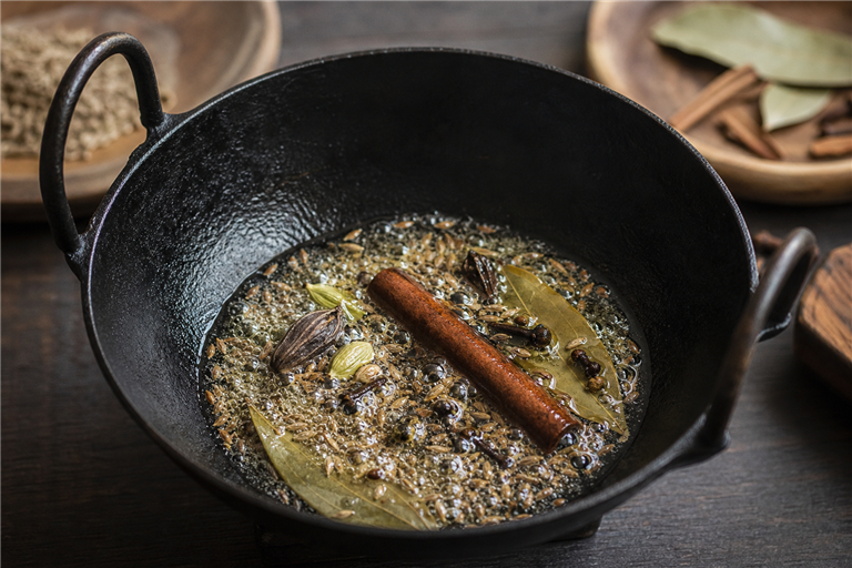 Step 1: whole black and green cardamom, cinnamon stick, cloves, bay leaves and cumin cra