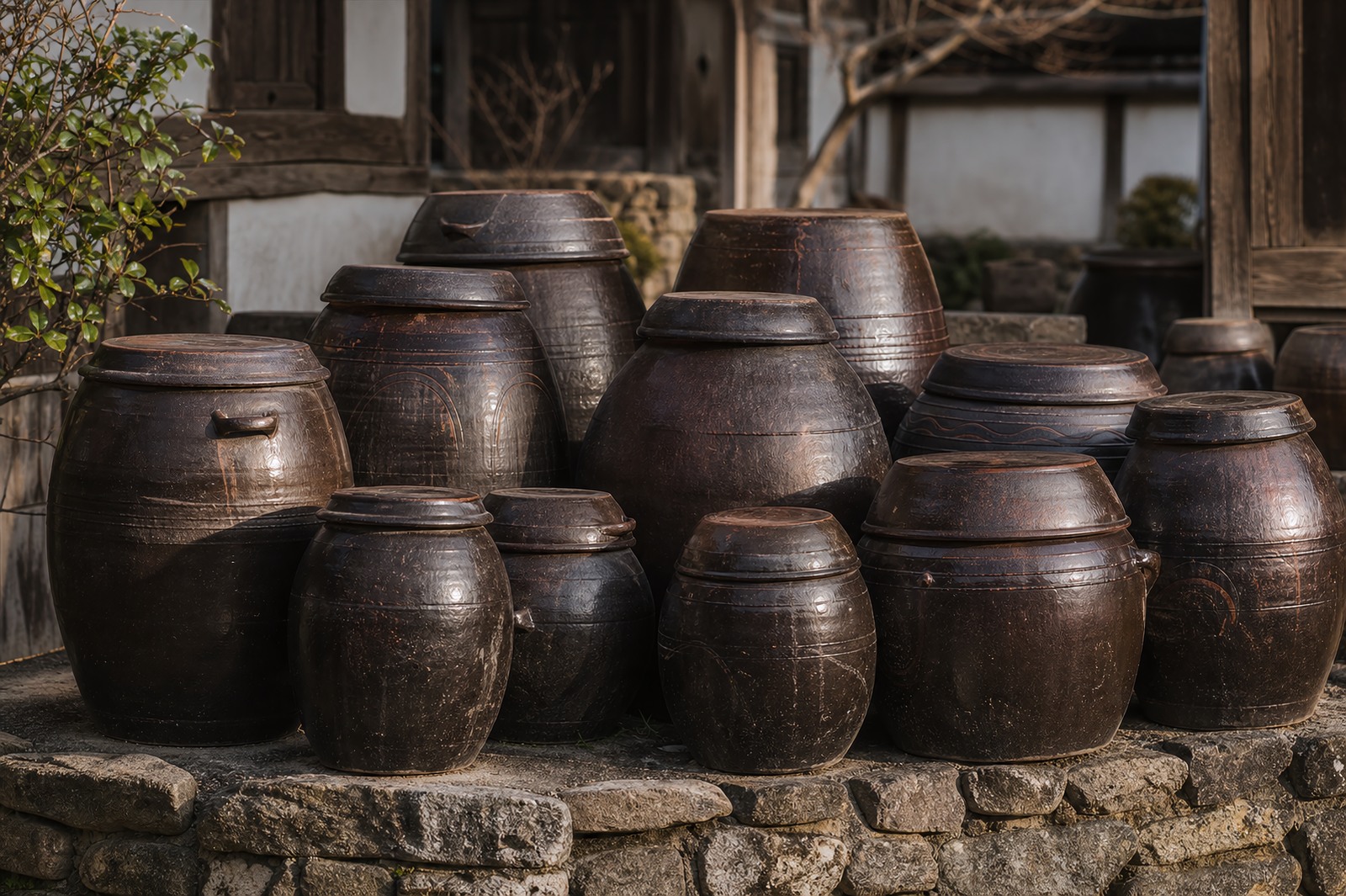 A traditional Korean jangdokdae of dark earthenware onggi jars where the fermented sauces age